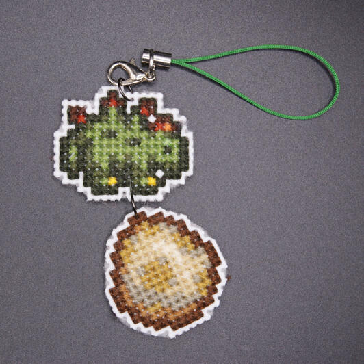 Stardew Valley dinosaur cross stitch charm